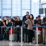 PHOTO: People wait in a security check line at George Bush Intercontinental Airport in Houston, Texas, on November 4, 2025.