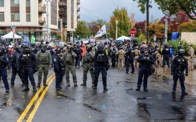 PHOTO: People participate in a protest organized by Portland Against Deportations at the ICE facility in Portland