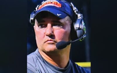 Missing Virginia football coach wanted on child sex abuse charges walked into woods with gun, family says